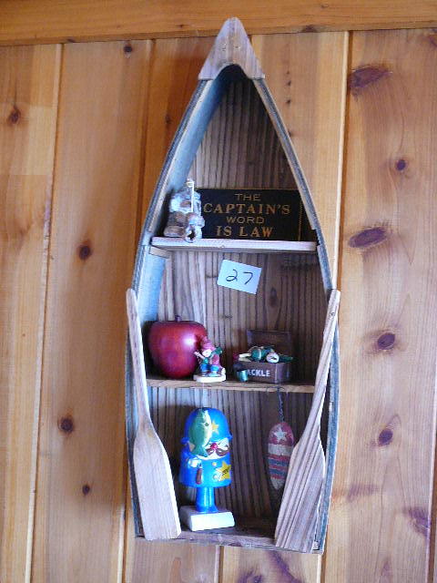 lot 27 image: Decorative Row Boat with figurines