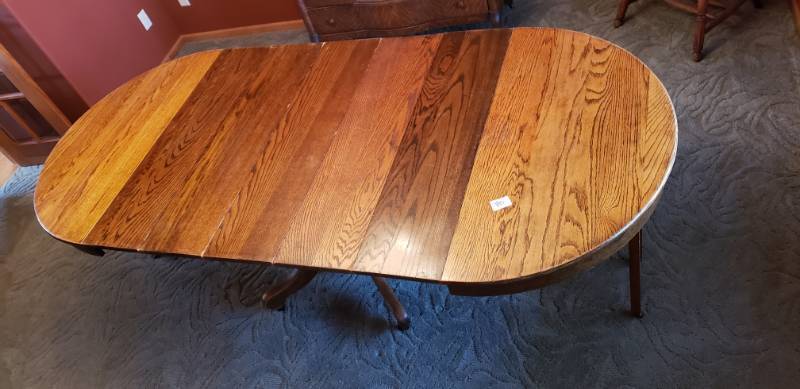 lot 80 image: Antique Early 1900s Solid Oak Dining Room Table With Leaves