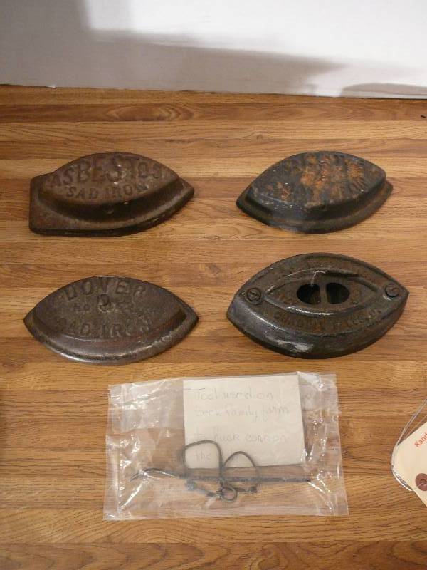 lot 608 image: Sad Iron bottoms, Corn husker tool