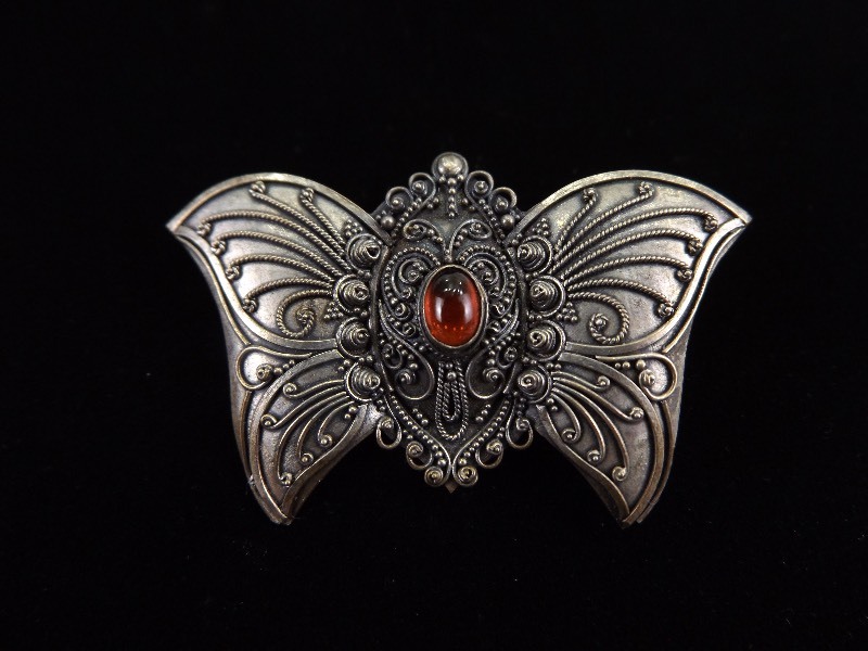 lot 39 image: .925 Sterling Silver Garnet Cabochon Butterfly Brooch