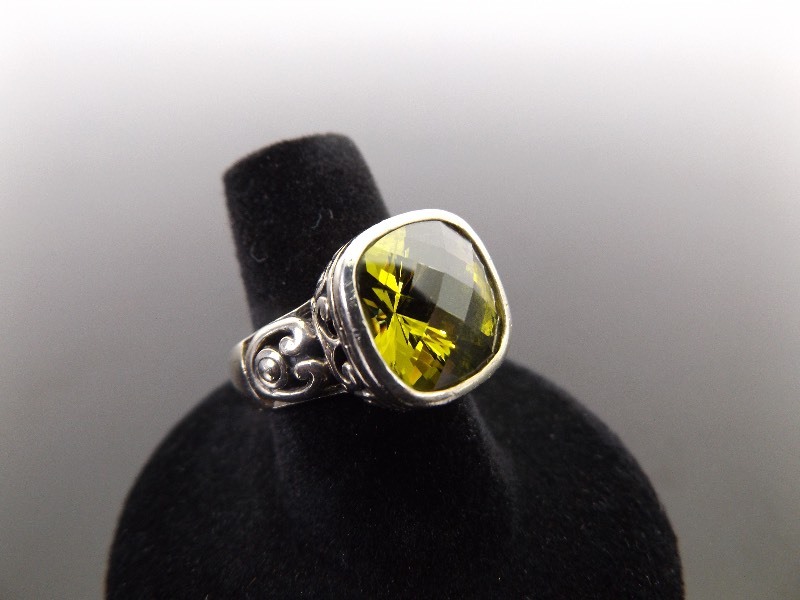 lot 47 image: .925 Sterling Silver Faceted Peridot Ring Size 7.25