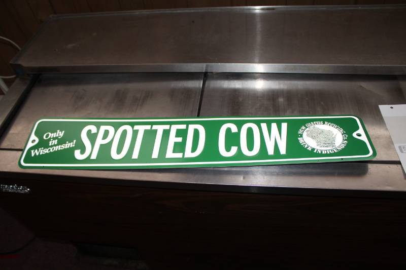 lot 91 image: Spotted Cow Beer Sign