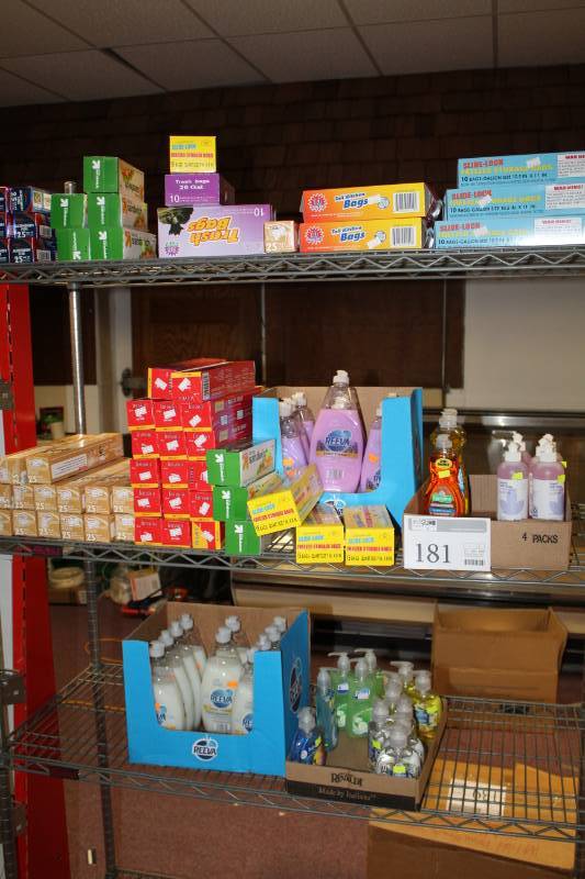 lot 181 image: Reeva Hand Therapy Tropical Shea Butter 24oz., Dial Hand Soap, Liquid Dish Soap, Plastic Wrap, Parchment Paper, Aluminum Foil, Sandwich Bags, And More