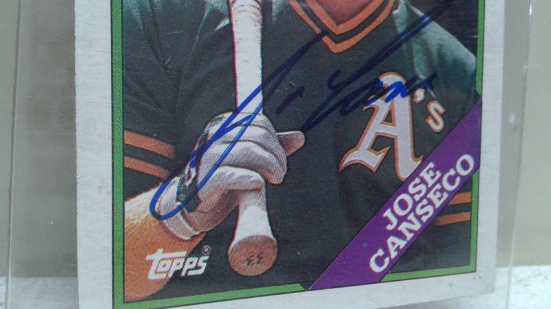 lot 52 image: 1988 Autographed Topps Jose Canseco Baseball Card