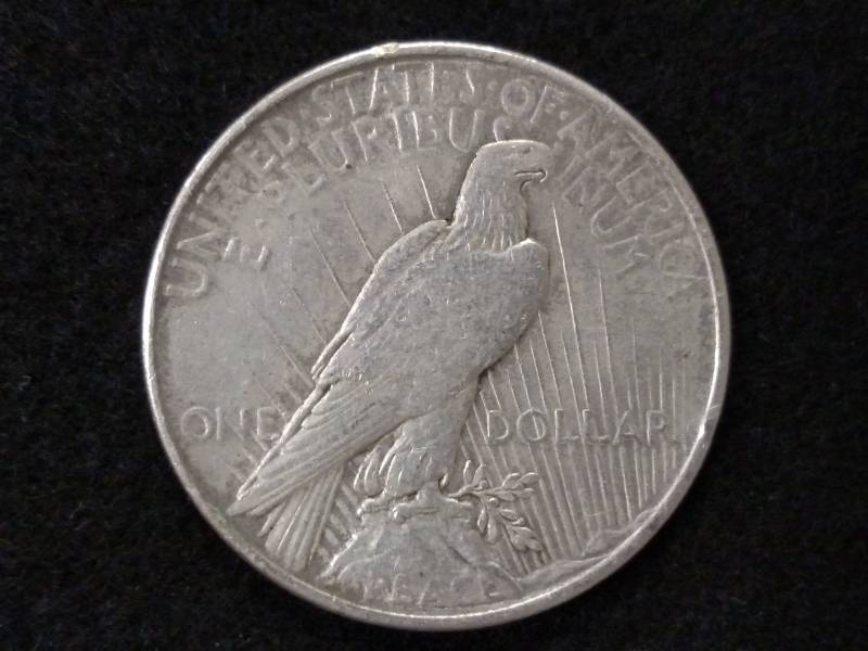 lot 45 image: 1925 Peace Silver Dollar...