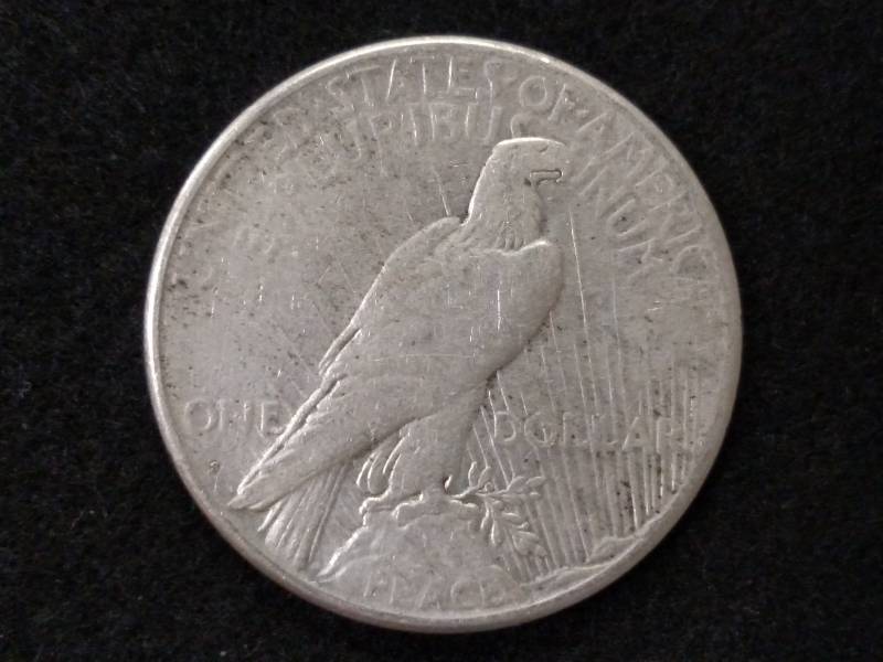 lot 46 image: 1925 S Peace Silver Dollar...