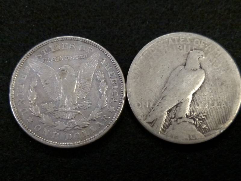 lot 50 image: (2) Silver Dollars...