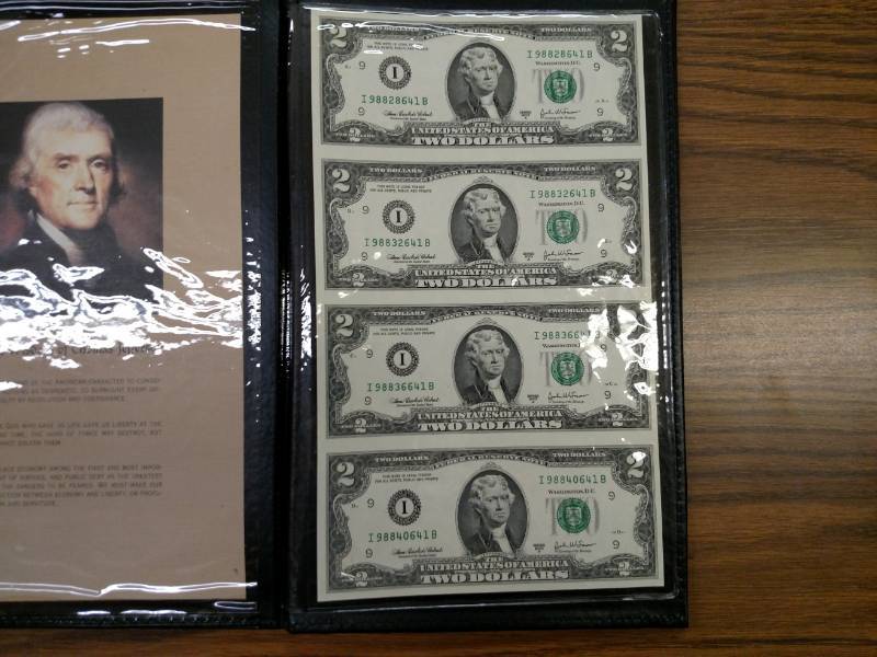 lot 124 image: Book of (4) Uncut 2003 A Two Dollar...