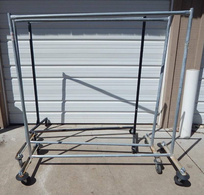 Lot of Rolling Clothing Racks and Display Rack