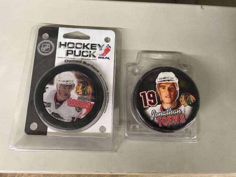 lot 161 image: Two Jonathan Toews Pucks