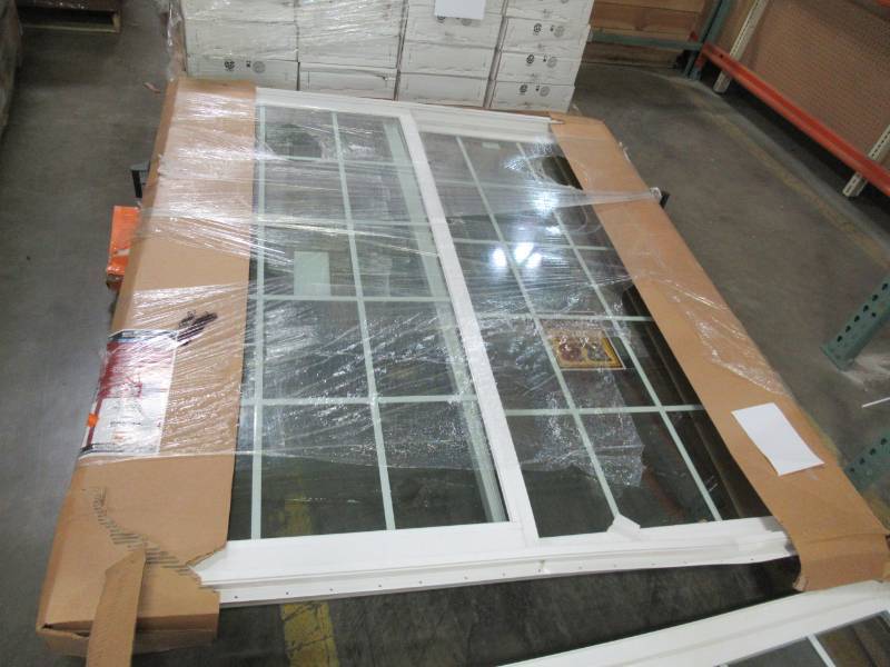 lot 82 image: ReliaBilt Grilles Between The Glass White Vinyl Sliding Patio Door With Insulating Core (Common 72-in X 80-in Actual 70.75-in x 79.5-in) - Frame Damaged - Doors are in nice condition.
