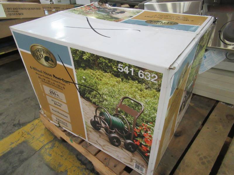 lot 93 image: Hampton Bay 4-Wheel Hose Cart. Model 840