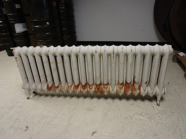 lot 209 image: CAST IRON FLOOR MOUNTED RADIATOR HEATER