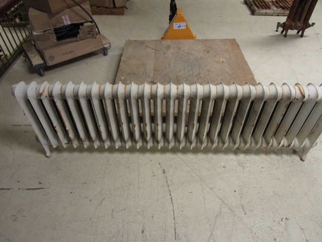 lot 211 image: CAST IRON FLOOR MOUNTED RADIATOR HEATER