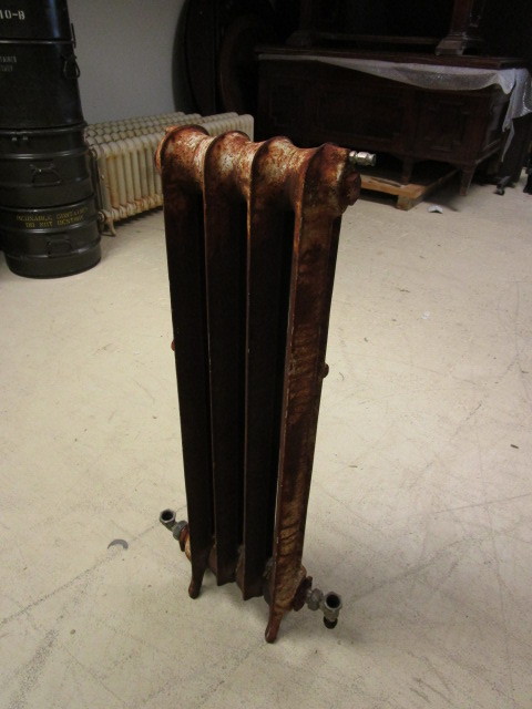 lot 213 image: CAST IRON FLOOR MOUNTED RADIATOR HEATER