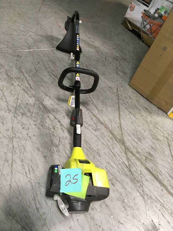 lot 25 image: RYOBI 25cc 2-Cycle Attachment Capable Full Crank Curved Shaft Gas String Trimmer  in good condition