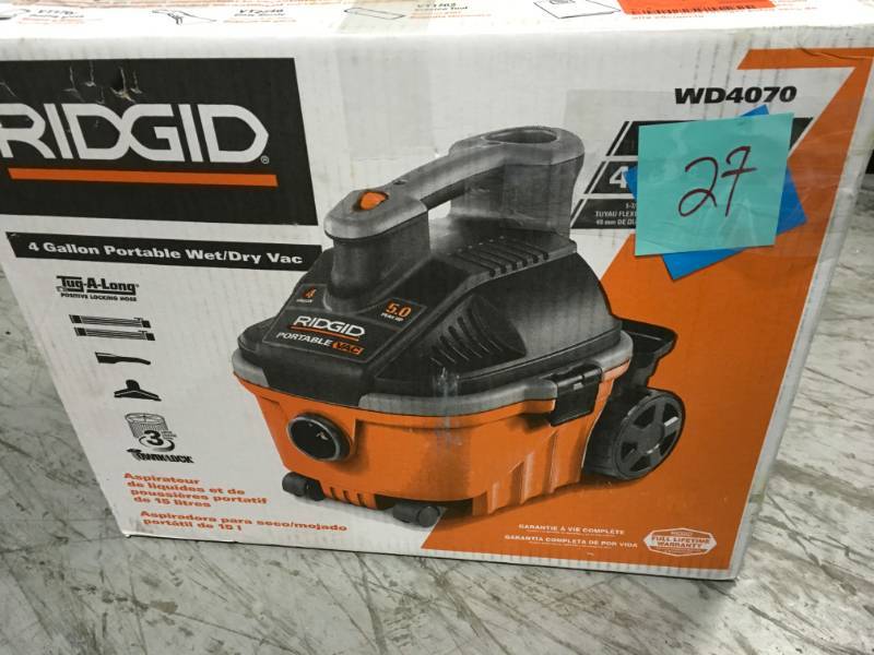 lot 27 image: RIDGID 4 Gal. 5.0-Peak HP Portable WetDry Vacuum  in good condition
