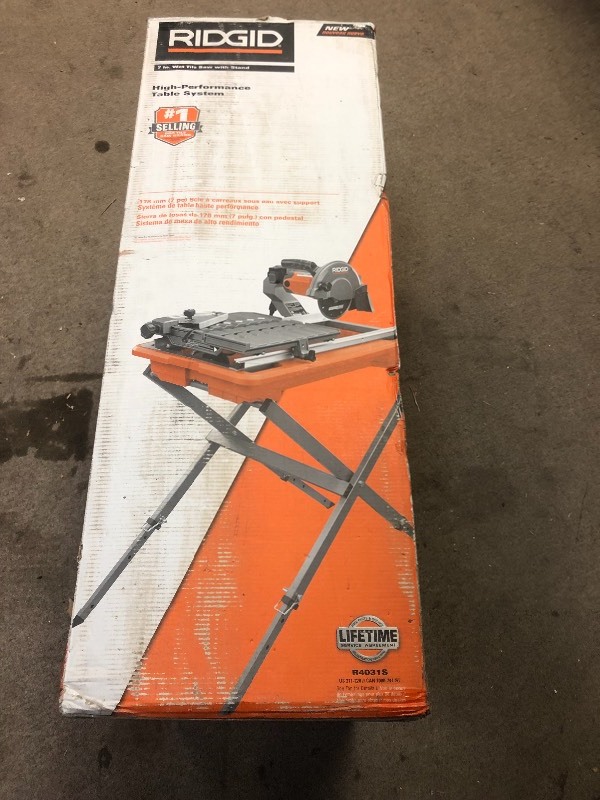 lot 105 image: RIDGID 9 Amp Corded 7 in. Wet Tile Saw with Stand in good conditions