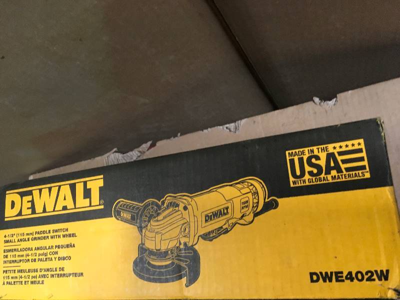 lot 55 image: DEWALT 11-Amp Corded 4-12 in. Small Angle Grinder  in good condition