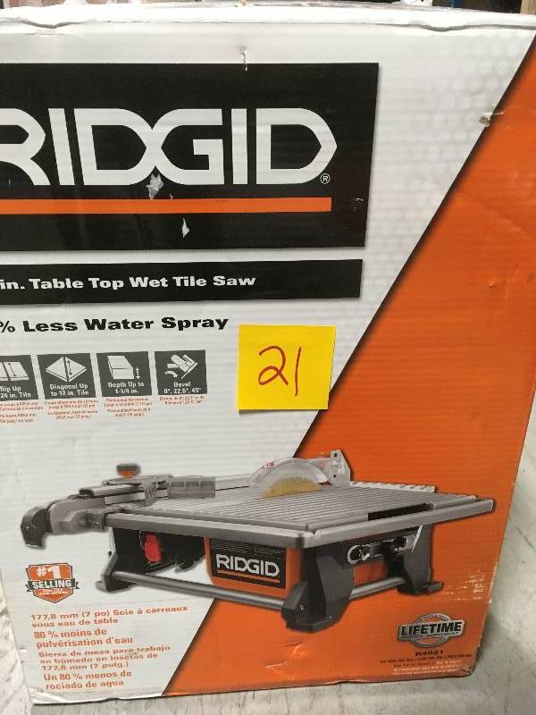 lot 21 image: RIDGID 6.5 Amp Corded 7 in. Table Top Wet Tile Saw in good condition