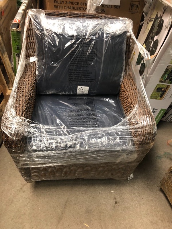 lot 112 image: Hampton Bay Cambridge Brown Wicker Swivel Outdoor Rocking Chair with Blue Cushions not used