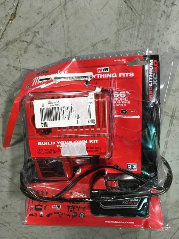 lot 101 image: Milwaukee M18 18-Volt Lithium-Ion XC Starter Kit with (1) 5.0Ah Battery and Charger in good condition