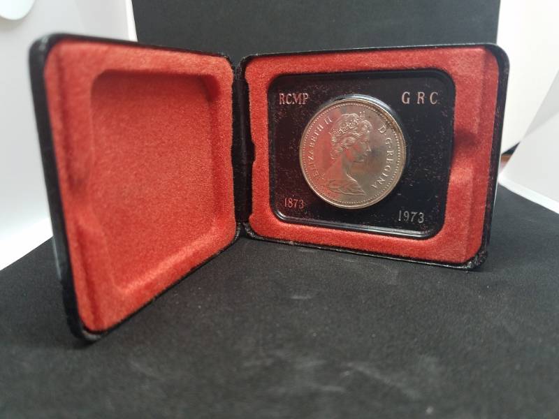 lot 65 image: Royal Canadian Mounted Police GRC 1873 - 1973 Silver coin and case
