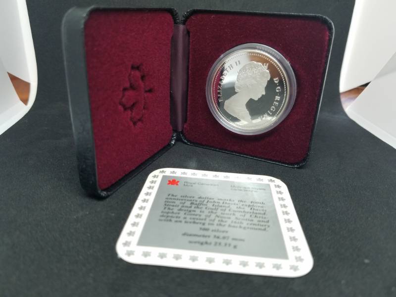 lot 66 image: 1587 - 1987 Royal Canadian Mint Silver Dollar Detroit de Davis Strait 50% Silver