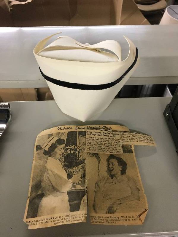 lot 181 image: Nurse Cap & Newspaper Article