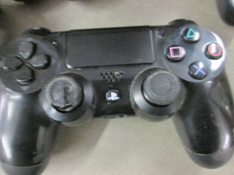 Lot of 4 Play Station Controllers...