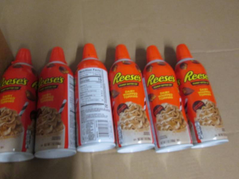 6 Cans of Reeses peanut butter cup...