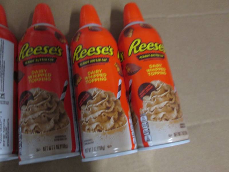 6 Cans of Reeses peanut butter cup...