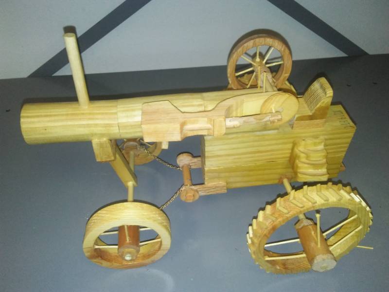 lot 17 image: Wood tractor, 14 in. With steering chains and working hydraulic wheel