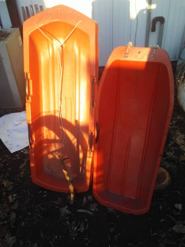 lot 44 image: 2 vintage plastic snow sleds, Norca.
