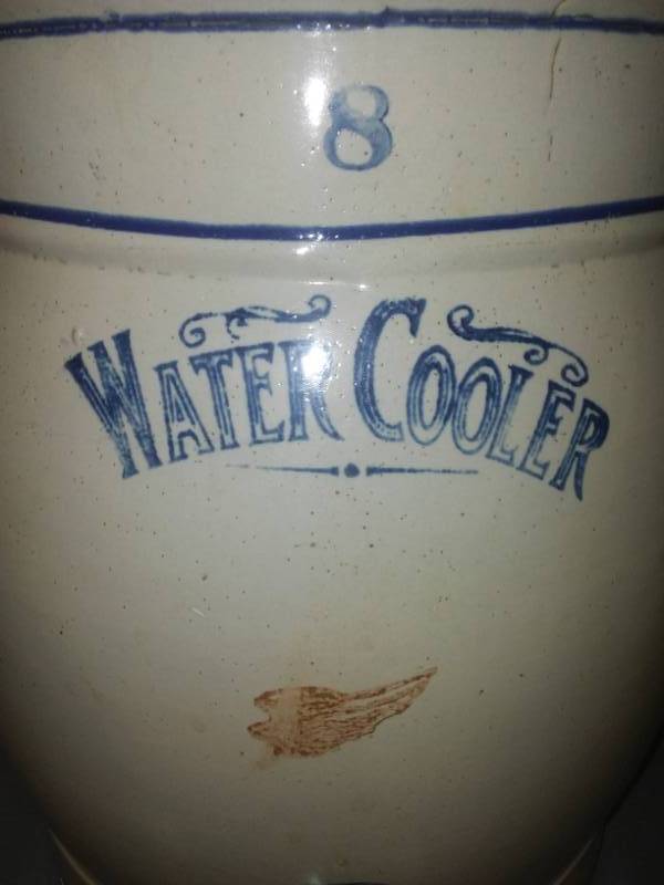 lot 51 image: Red Wing water cooler crock 8, with spout and handles, 17 in tall.