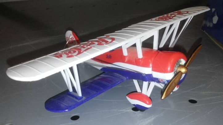 lot 61 image: Pepsi-Cola by plane airplane metal with box.