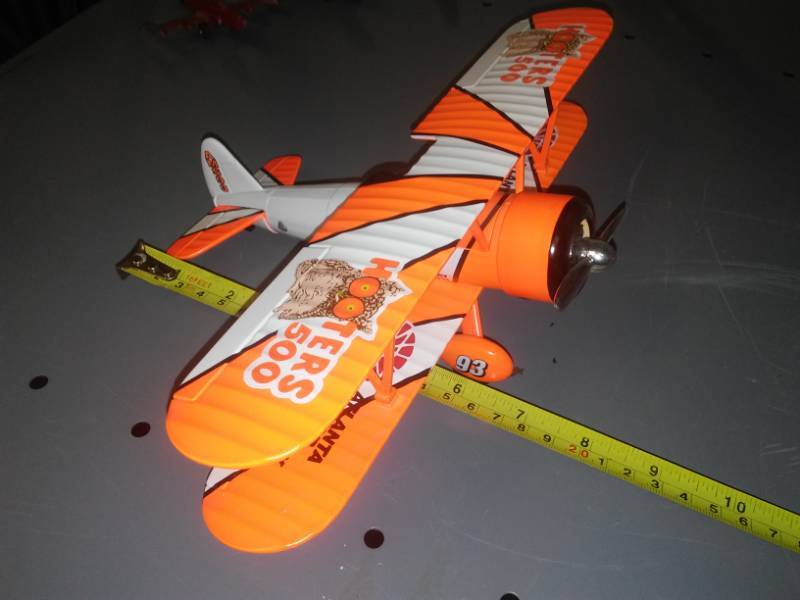 lot 64 image: Hooters airplane biplane metal excellent.