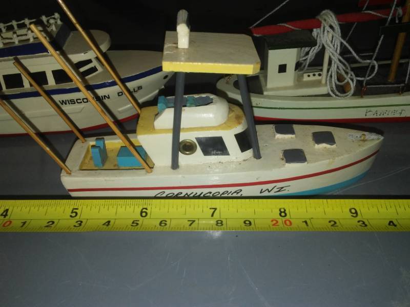 lot 83 image: Miscellaneous wood handmade boats - small Wisconsin themed.