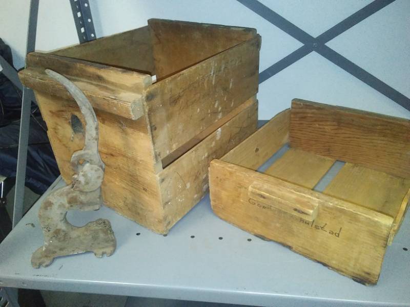 lot 86 image: Two primitive wood boxes and cast punch.