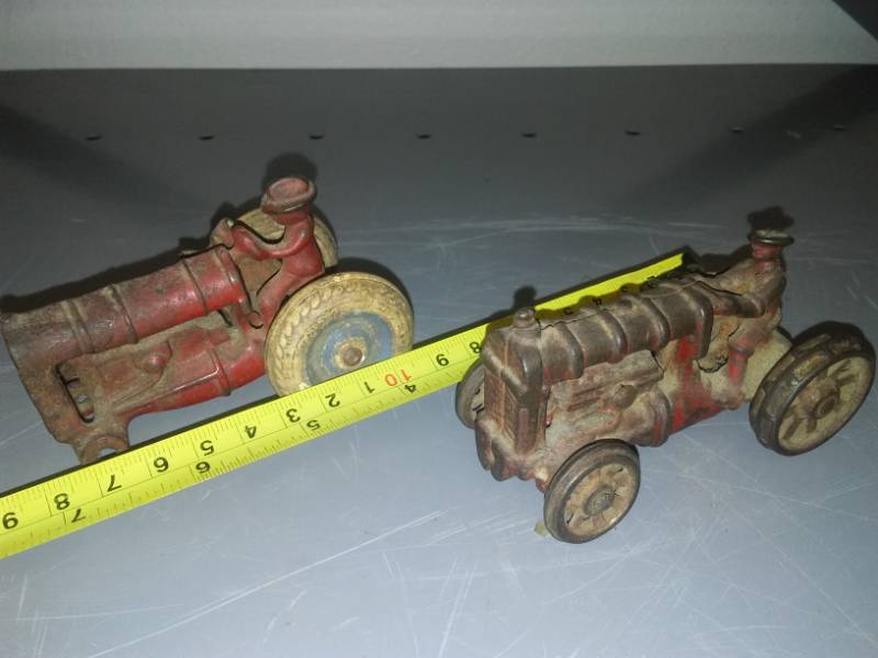 lot 110 image: 2 cast tractors, one is partial.