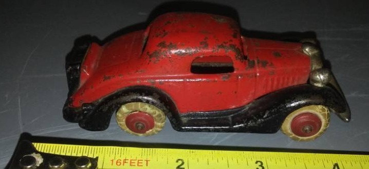 lot 113 image: vintage cast 2 door coupe car.