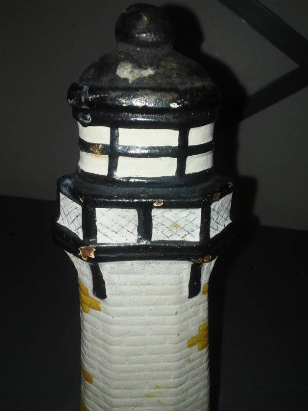 lot 122 image: Cast door stop - lighthouse.