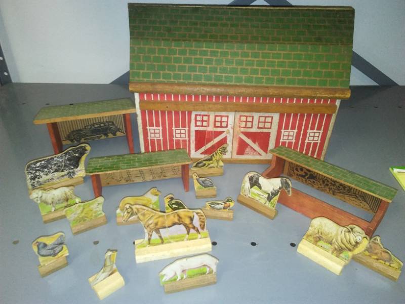 lot 126 image: Fisher Price wood barn and farm yard set up.