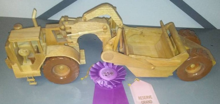 lot 137 image: Wood dirt scraper construction hauler 22in Im a moving Parts, rules. Grand Champion, Oak, hand carved.