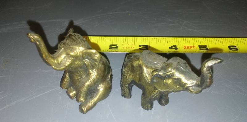lot 143 image: 2 brass elephants.
