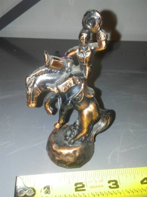 lot 146 image: Brass cowboy on bucking horse