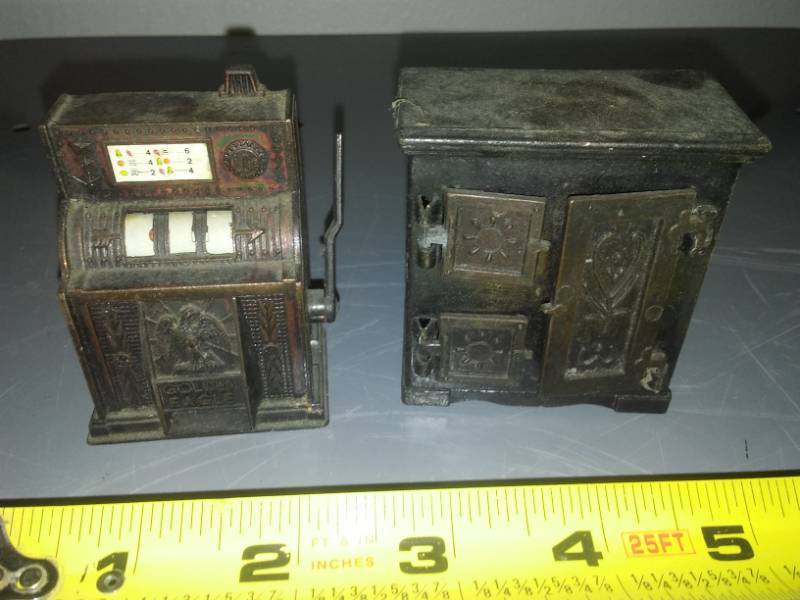 lot 148 image: Cast refrigerator and slot machine.