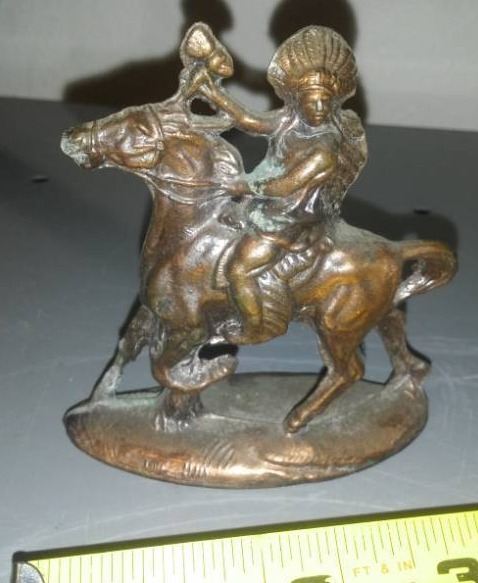 lot 153 image: Solid brass chief on horse.