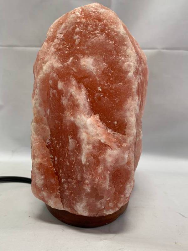 lot 77 image: Brand New Himalayan Salt Lamp with Light & Wood Base