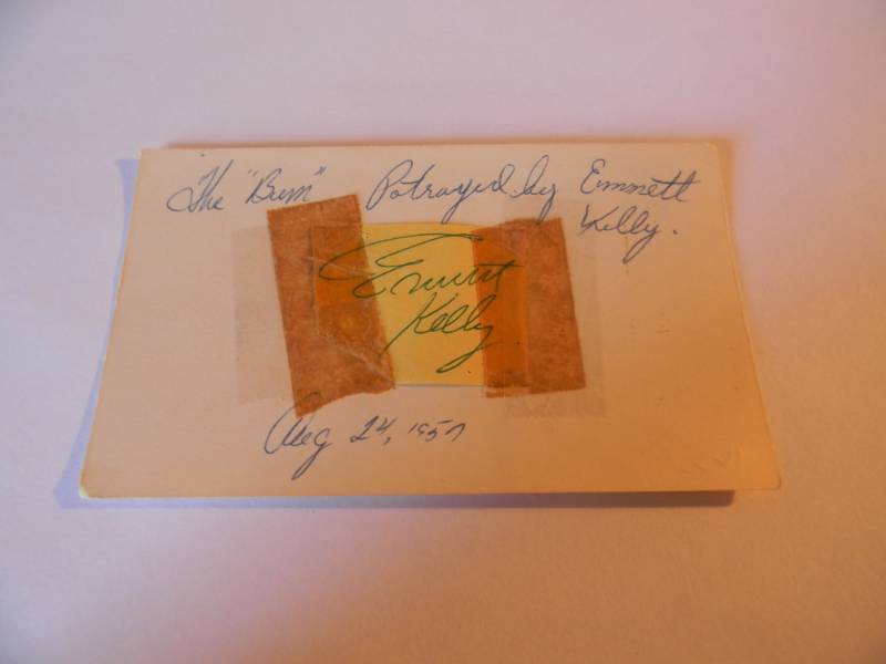 lot 45 image: THE BUM - PORTRAYED BY EMMETT KELLY AUTOGRAPH - AUTHNETIC - NICE NOSTALGIC PIECE - SIGNED AUG. 14TH 1957 - SEE PICTURES